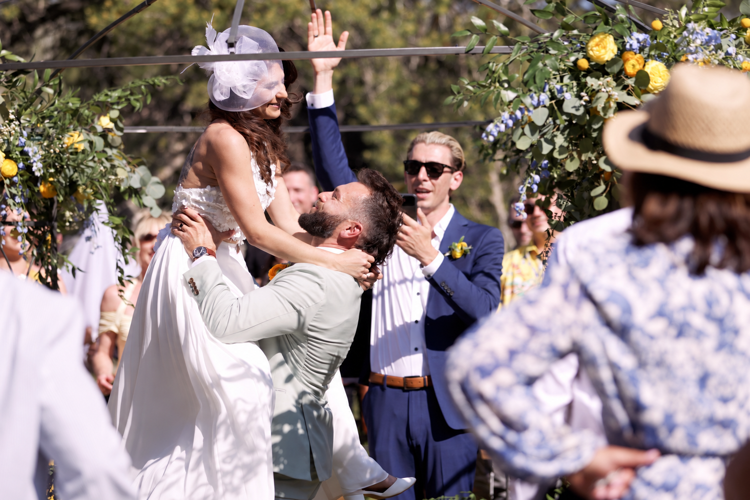 A couple celebrating their wedding ceremony with TREVAN and their guests