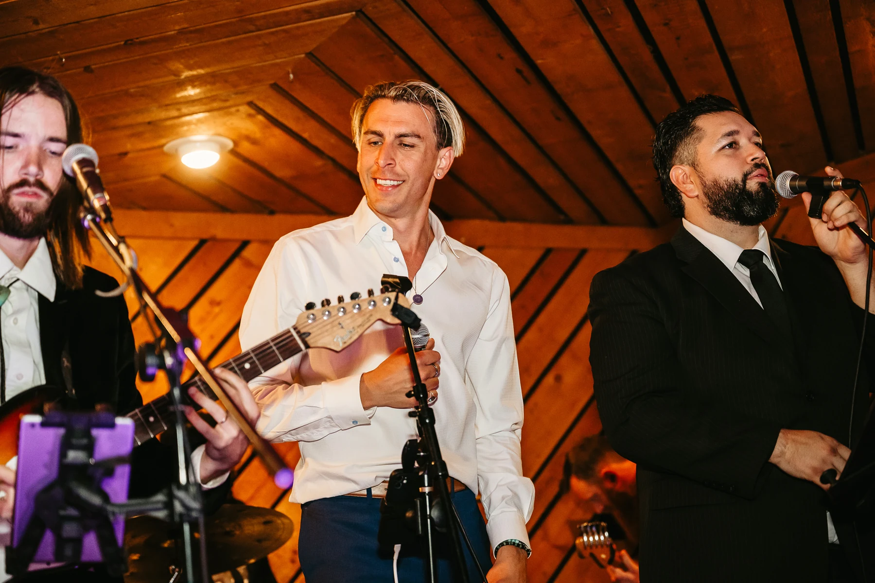TREVAN performing onstage with fellow musicians