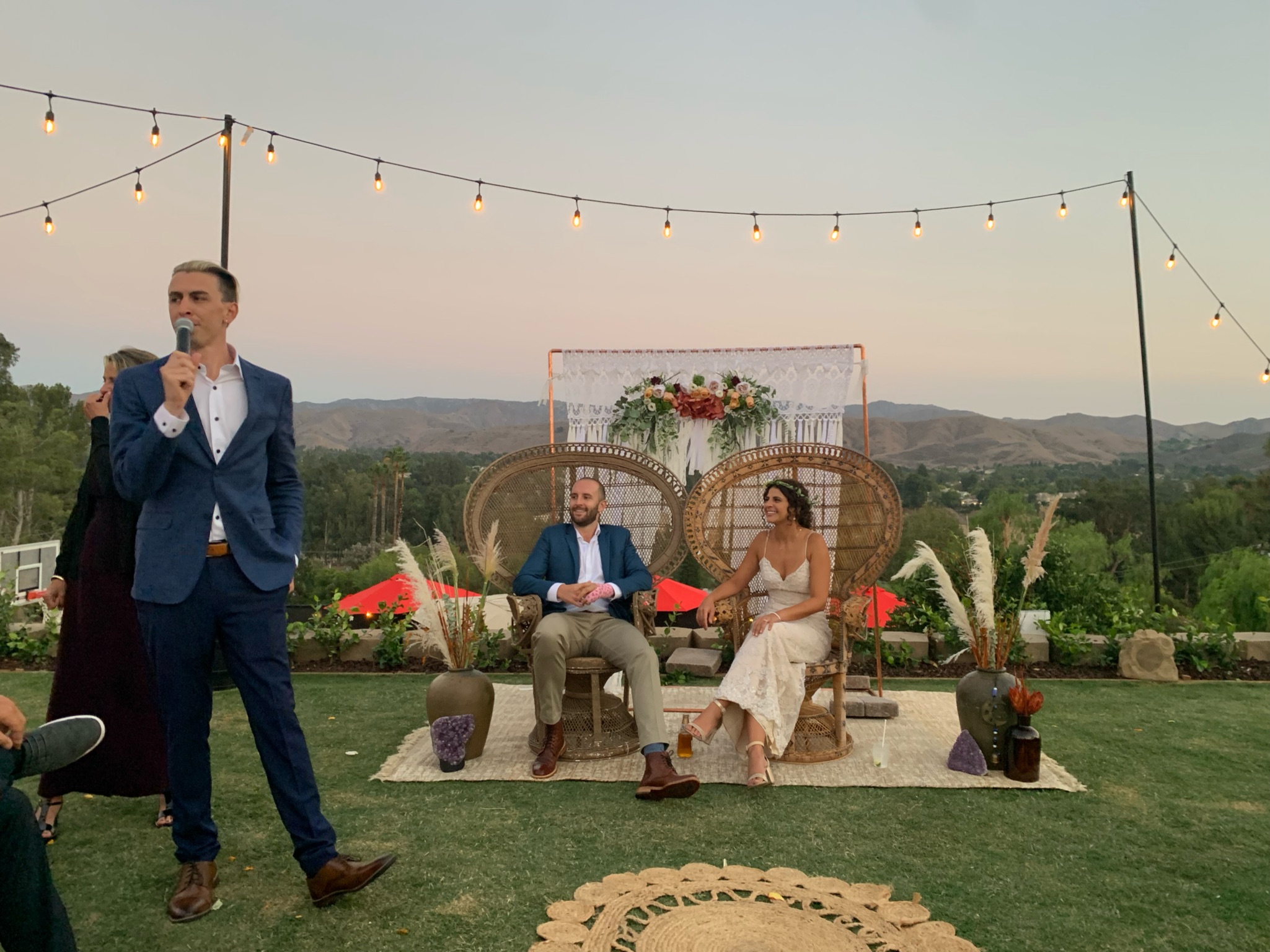 TREVAN hosting an outdoor wedding reception at sunset